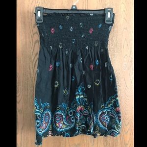 Black sleeveless top with colorful print